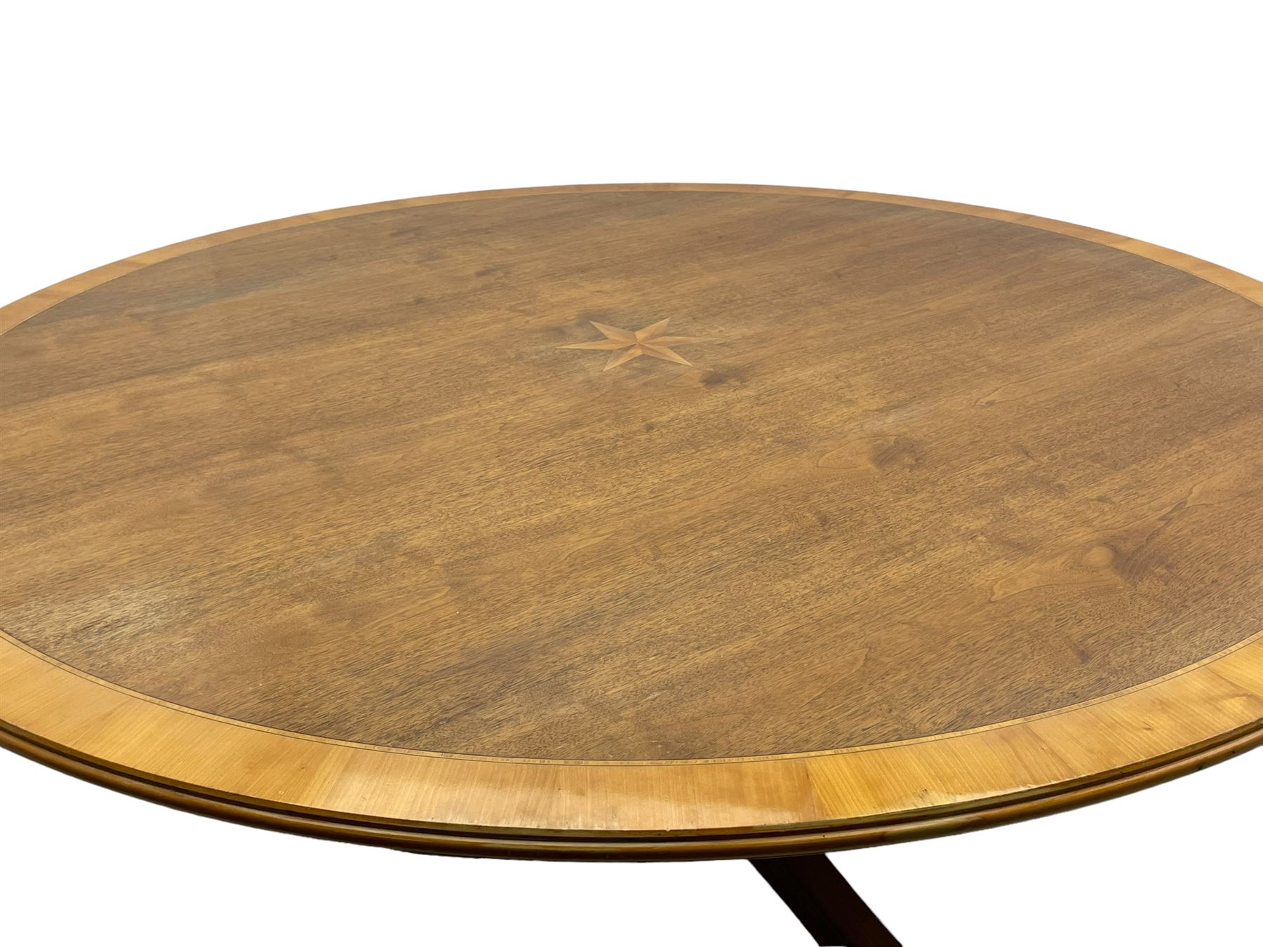 Senior & Carmichael, Betchworth - Georgian design walnut centre table, the circular moulded top with satinwood band and central star inlay, quadriform base with central orb and applied makers plaque, raised on splayed supports