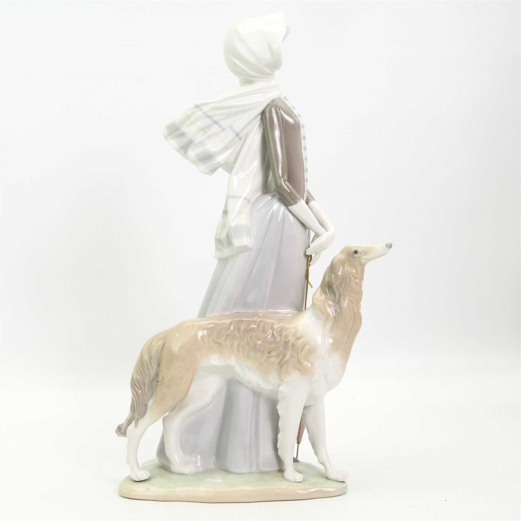 Large Lladro figure of a lady with a Borzoi and holding a parasol H39cm