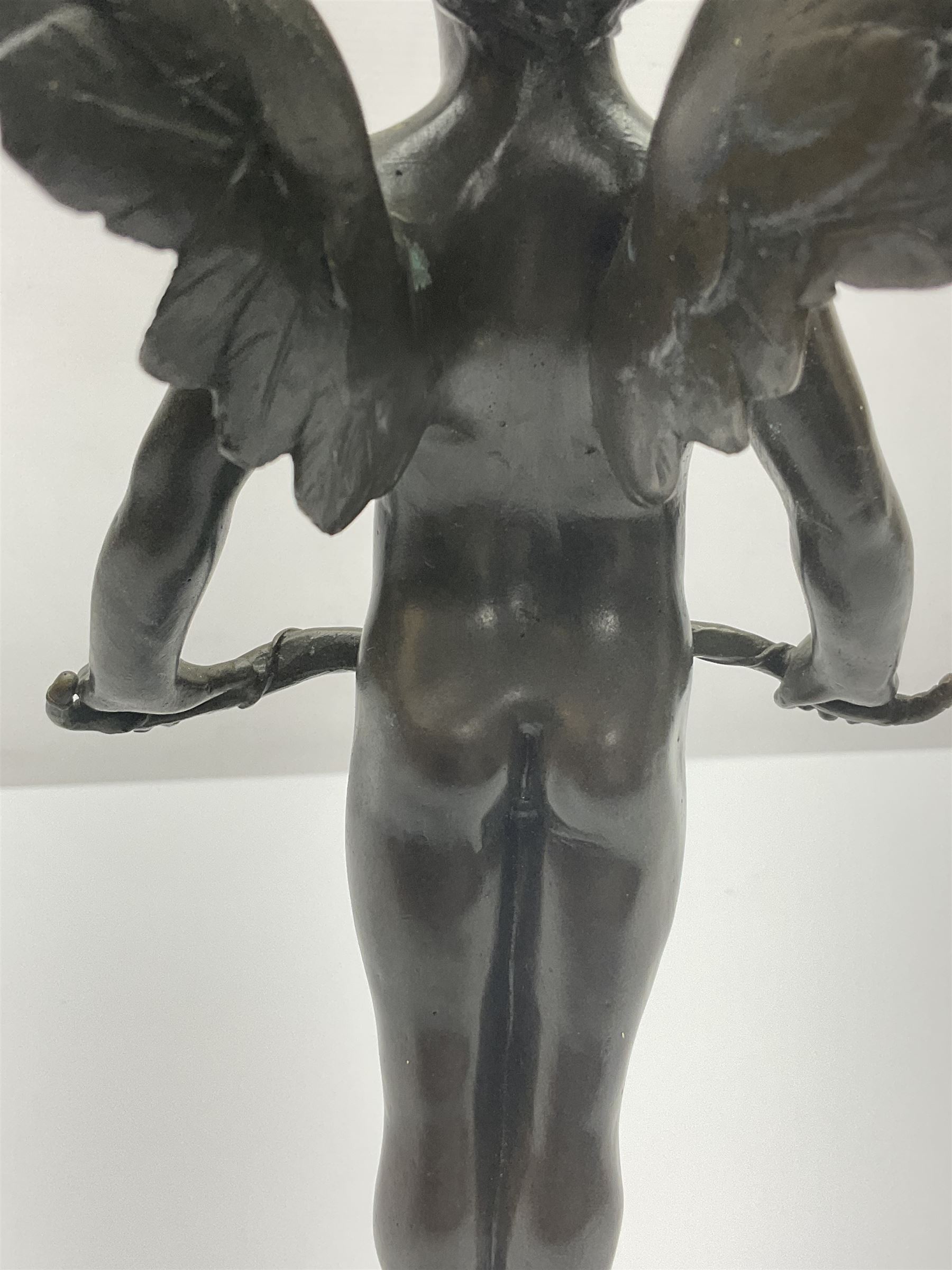 After Moreau, bronzed figure modeled as an angel holding a bow, with foundry mark upon socle base, H30cm