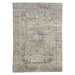 Persian Kashan pale green ground carpet, the busy field with central rosette medallion sur...