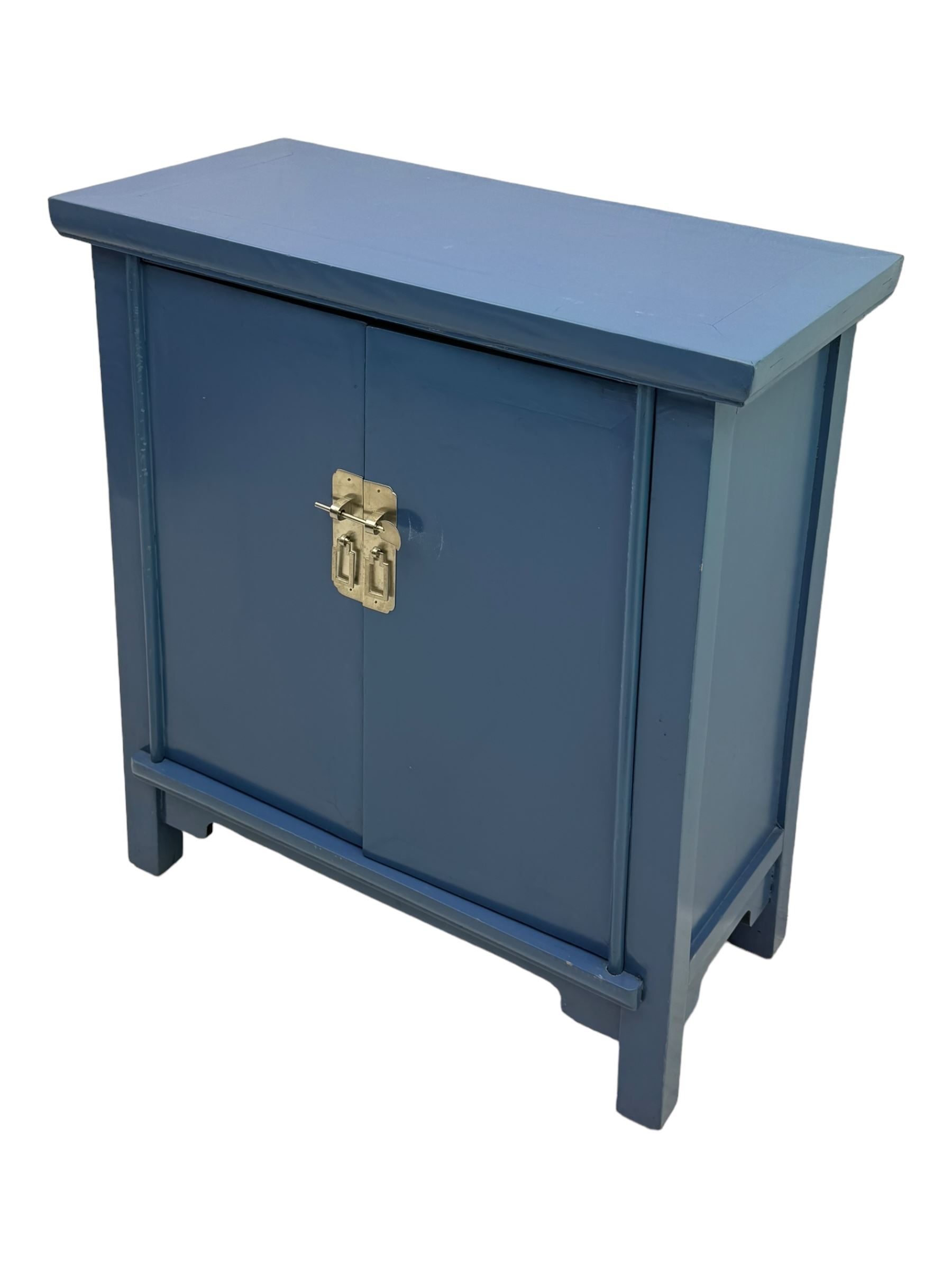 20th century Chinese blue lacquered cabinet, rectangular top over double doors with brass latch, interior fitted with shelves, on square supports