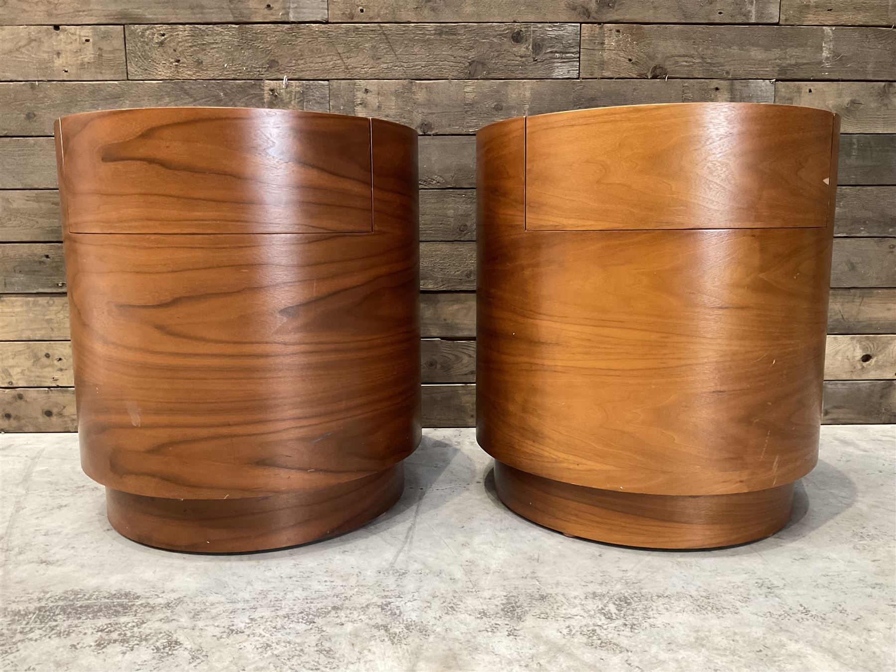 Pair of walnut circular barrel shaped lamp tables, fitted with single drawer