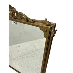 19th century gilt framed overmantel mirror, cartouche pediment surrounded by curling leaves, moulded framed enclosing plain mirror plate, decorated with applied trailing foliage motifs 