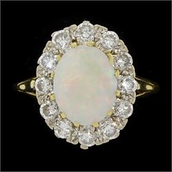 18ct gold opal and round brilliant cut diamond cluster ring, London 1990, total diamond we...