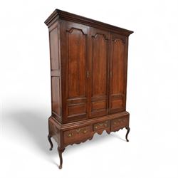 Georgian oak livery cupboard, projecting cornice over panelled front with mahogany banding...