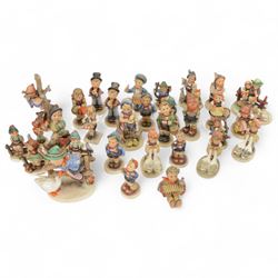 Collection of approximately  thirty four Hummel figures including Barnyard Hero, Strolling...