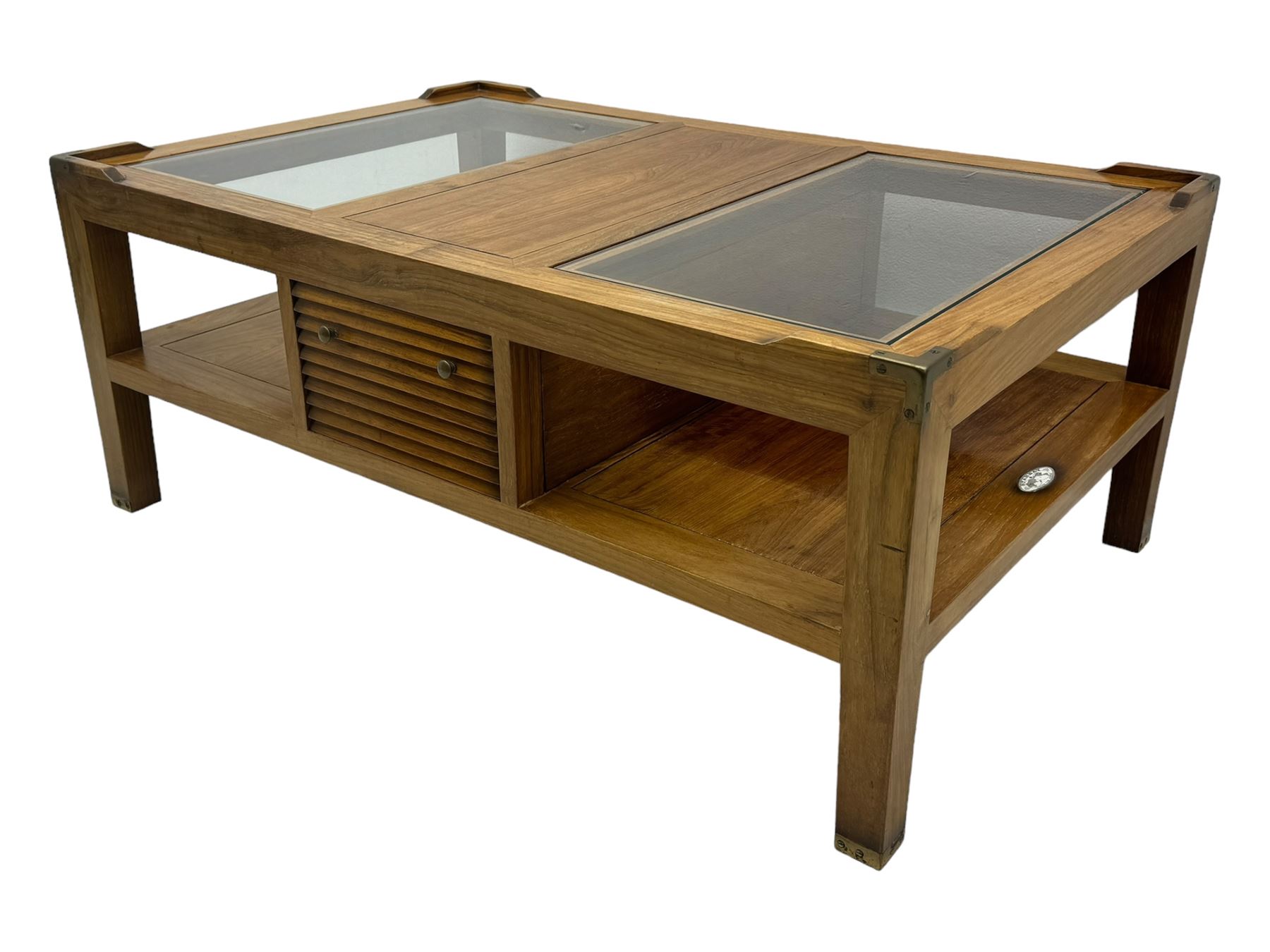 Starbay Tobago cherry wood coffee table, rectangular top with two inset glass panels, central drawer with louvred front and brass handles, flanked by open shelving, raised on square supports with metal corner brackets