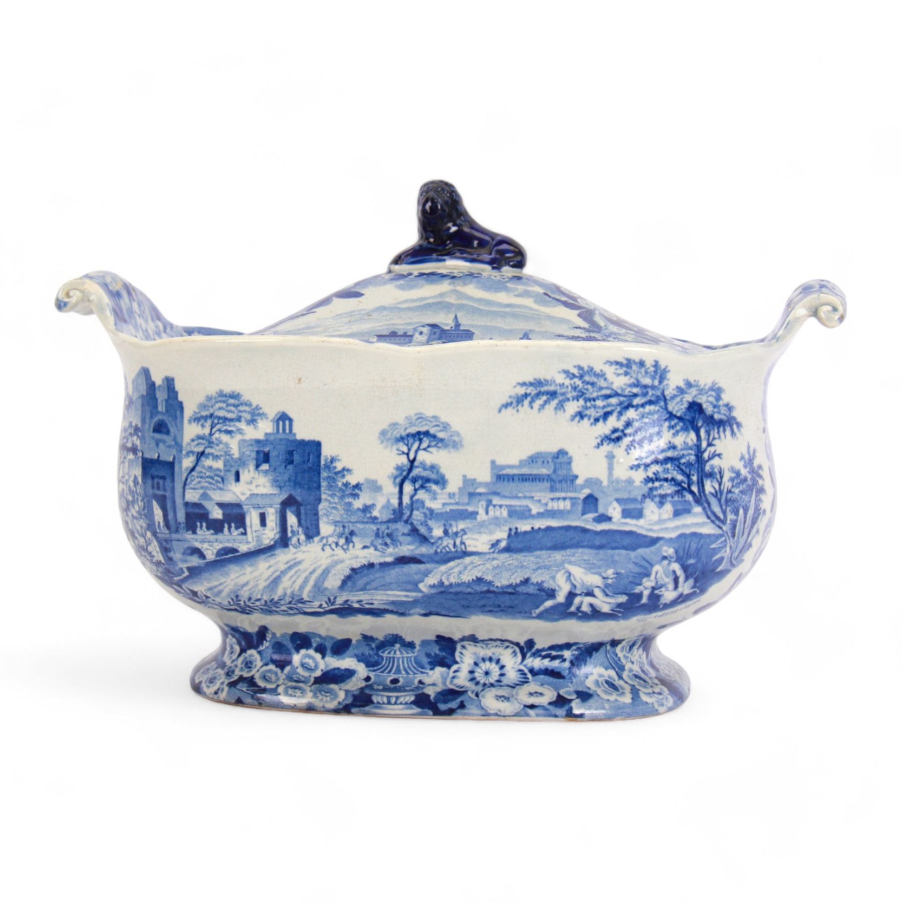 19th century Don Pottery blue and white transfer printed tureen and cover, decorated in the Named Italian Views Series pattern, with a view from The Augustini to one side, and Brundisium to the other, of oblong form with twin scroll handles and blue lion finial to the cover, with printed mark beneath, H21cm W32cm