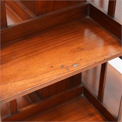 Edwardian mahogany revolving bookcase, square form with moulded top, two tiers with vertical moulded slats, on brass and ceramic castors 