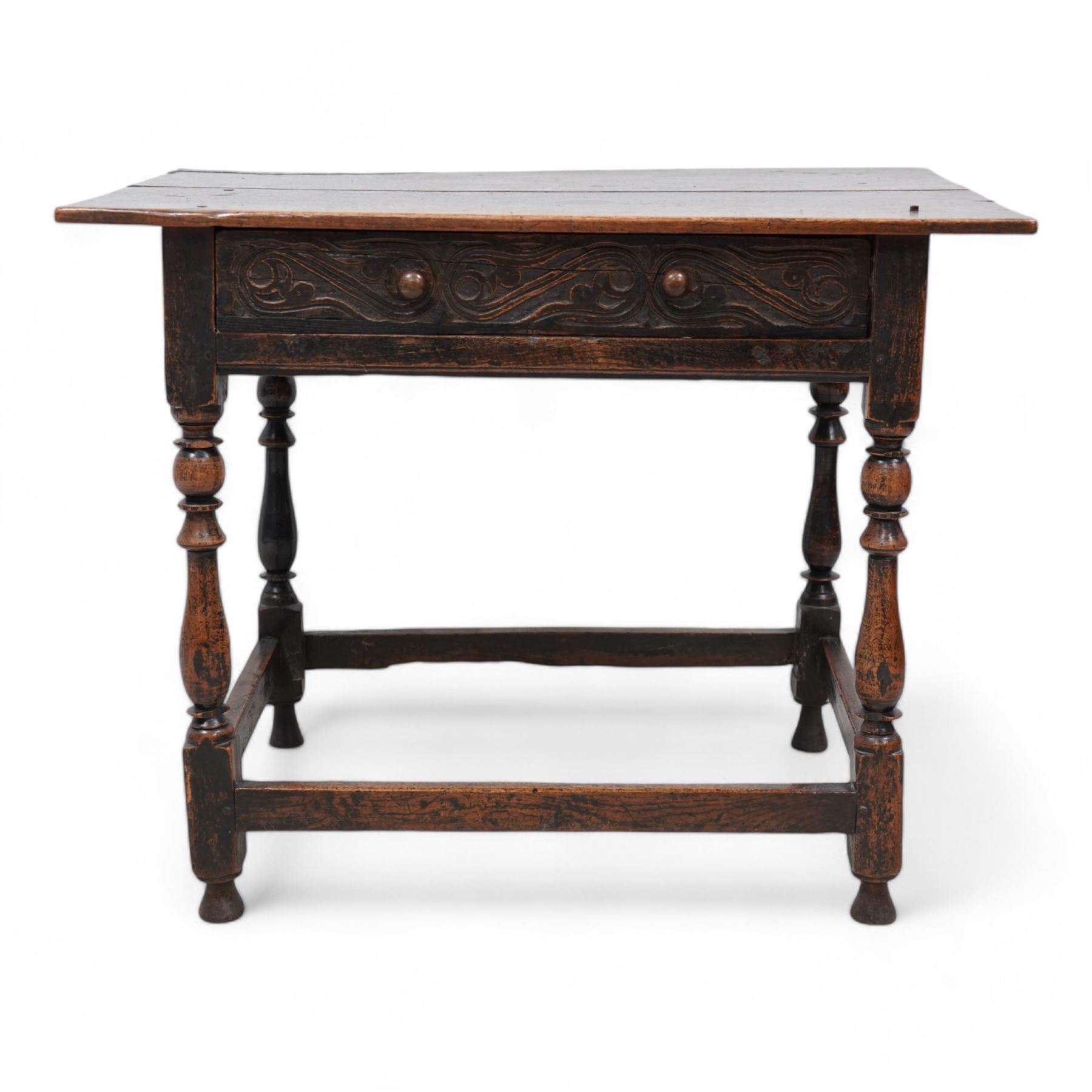 18th century oak side table, rectangular pegged two-plank top over singe drawer carved with S-scrolls, on turned supports united by plain stretchers 