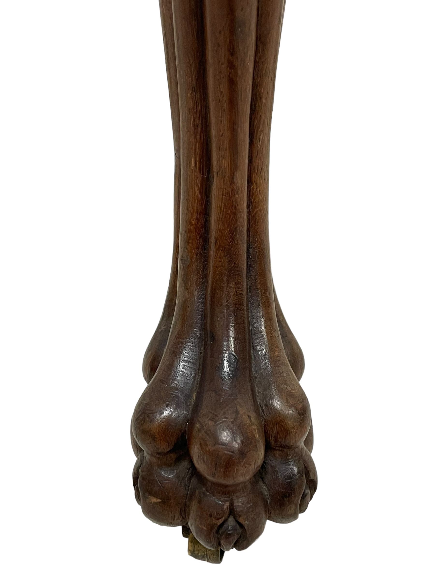 Georgian Irish mahogany dressing stool, overstuffed seat upholstered in in ivory damask fabric, the cabriole supports decorated with moulded interlacing scroll motifs with mycelium cap detail, over lobe carvings terminating to large paw feet