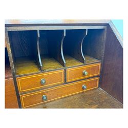 Mid-to-late 20th century inlaid mahogany bureau, inlaid floral medallion to the top, the fall front opening to reveal fitted interior with pigeonholes, small drawers and central cupboard, green inset writing surface with gilt tooling, four drawers below with brass handles, raised on shaped bracket feet