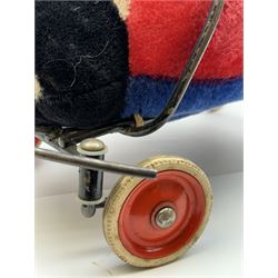 Steiff child's ride on ladybird, circa 1950s, the mohair body with red and black spotted seat, black and white face and blue underbelly, upon a metal frame with rubber and metal wheels, H30cm, W52cm