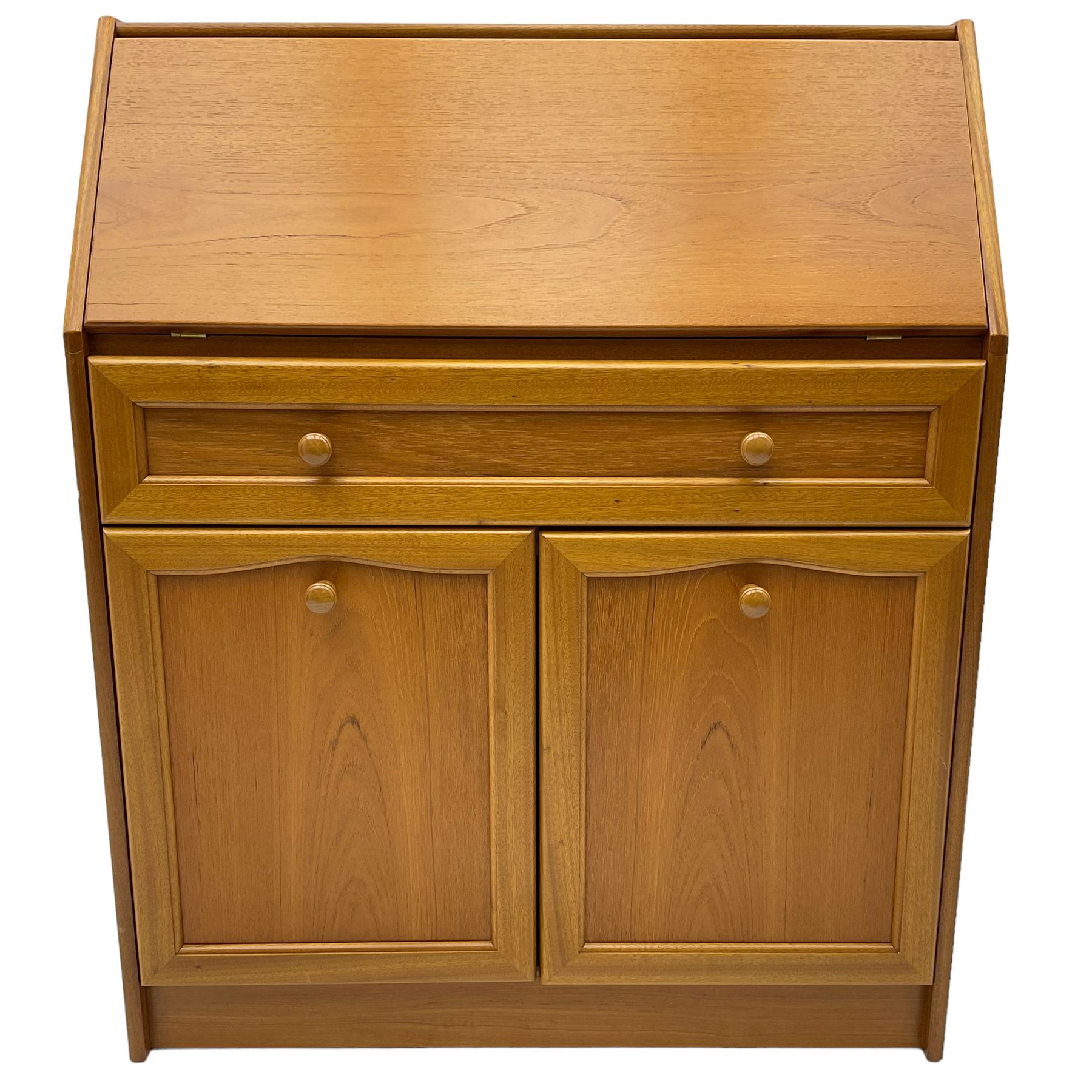 Mid 20th century teak bureau, sloped fall-front opening to reveal fitted interior with compartments, over panelled full width drawer and two cupboard doors, on recessed plinth base