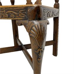 Elm 'Windsor' splat back corner armchair, shaped cresting rail carved with leaves over shaped and pierced splat, the curved arms carved with foliage and scrolled terminals, turned upper supports and a further two splats, panelled seat within foliate carved seat rails, on square rear supports with front shell carved cabriole support, united by plain x-frame stretchers