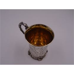 Victorian silver christening mug, of cylindrical form with fluted rim, gilt interior and acanthus capped C scroll handle, the body with later engraved decoration and initials, with embossed scroll base, hallmarked John Evans II, London 1840, including handle H10.2cm