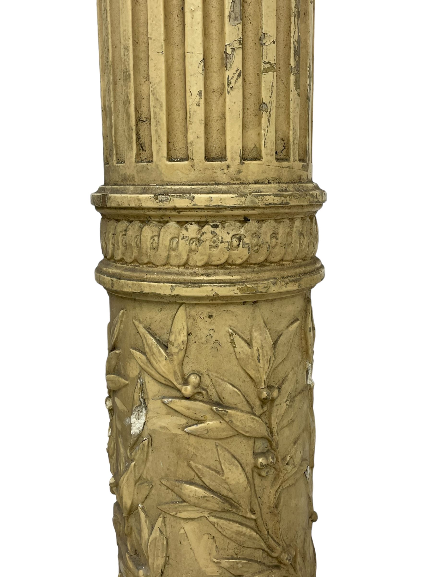 Three 19th century wood and gesso Composite order architectural architraves - curled acanthus leaf capitals over fluted shafts, the bases decorated with guilloche moulding over trailing laurel leaf branches, one half columns, one L-shaped rectangular pilaster and one full column, the largest - H204cm