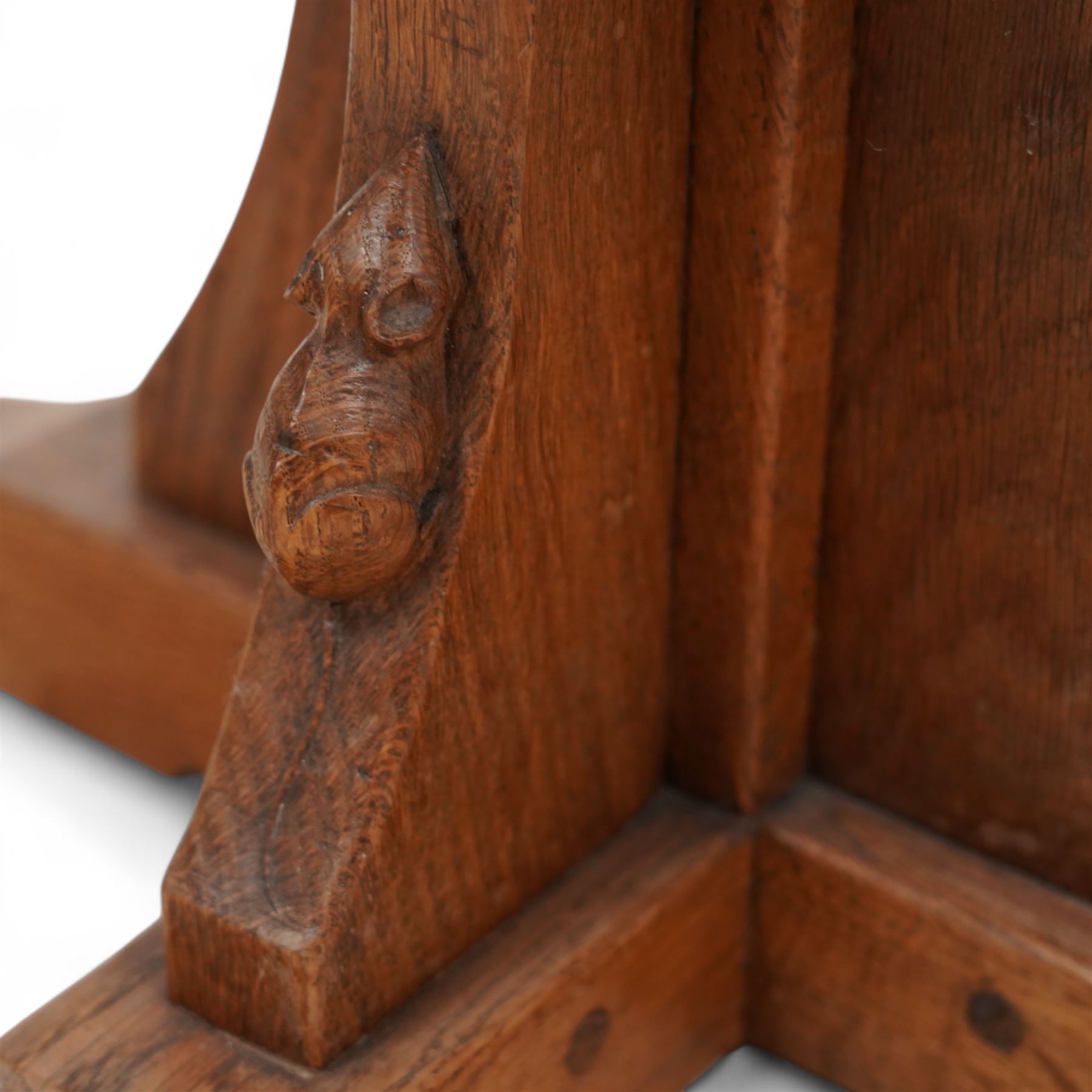 Mouseman - oak coffee table, octagonal adzed top on cruciform base and sledge feet, carved with mouse signature, by the workshop of Robert Thompson, Kilburn  