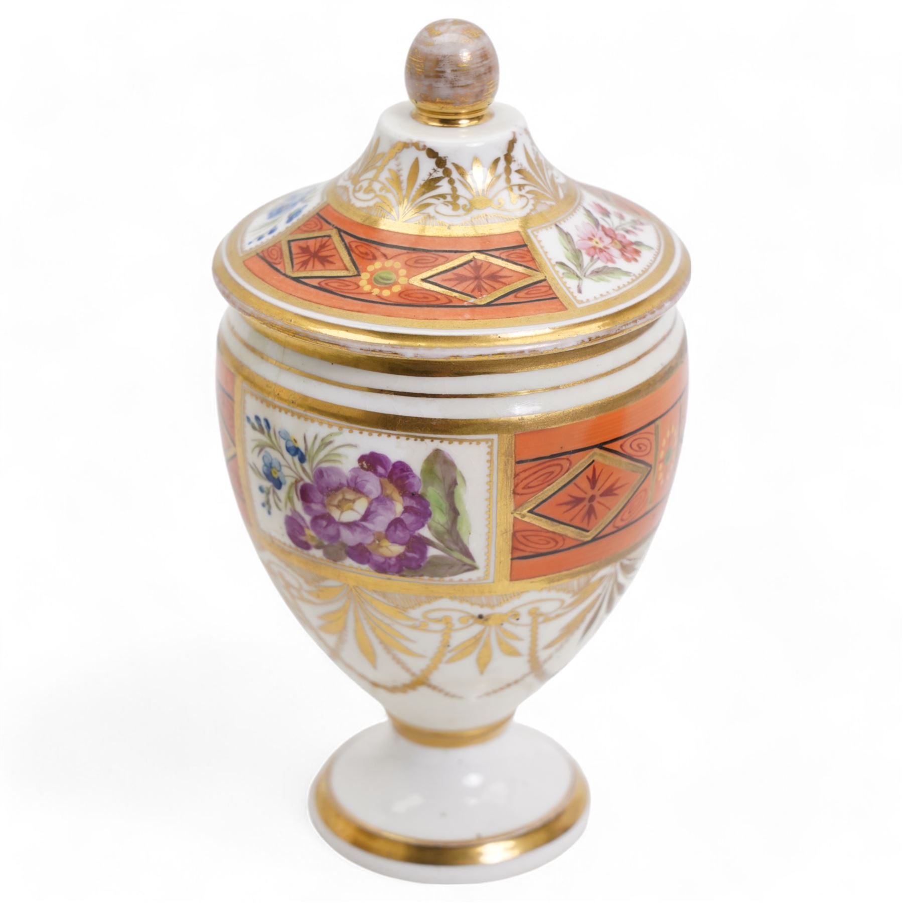 Early 19th century Spode pastille burner, of twin handled urn form, the body hand painted with a basket of flowers and further flowers and butterfly verso, within beaded border and lion paw stem, lacking cover, H8cm, 18th/19th century porcelain vase and cover, decorated with panels of flowers within orange and gilt bands, possibly Spode H16cm, together with an early 19th century Spode (1800-1820) pen tray, of oval form, decorated in raised gilt with two birds perched on a branch, within a fruiting vine border, pattern no. 093, L27cm