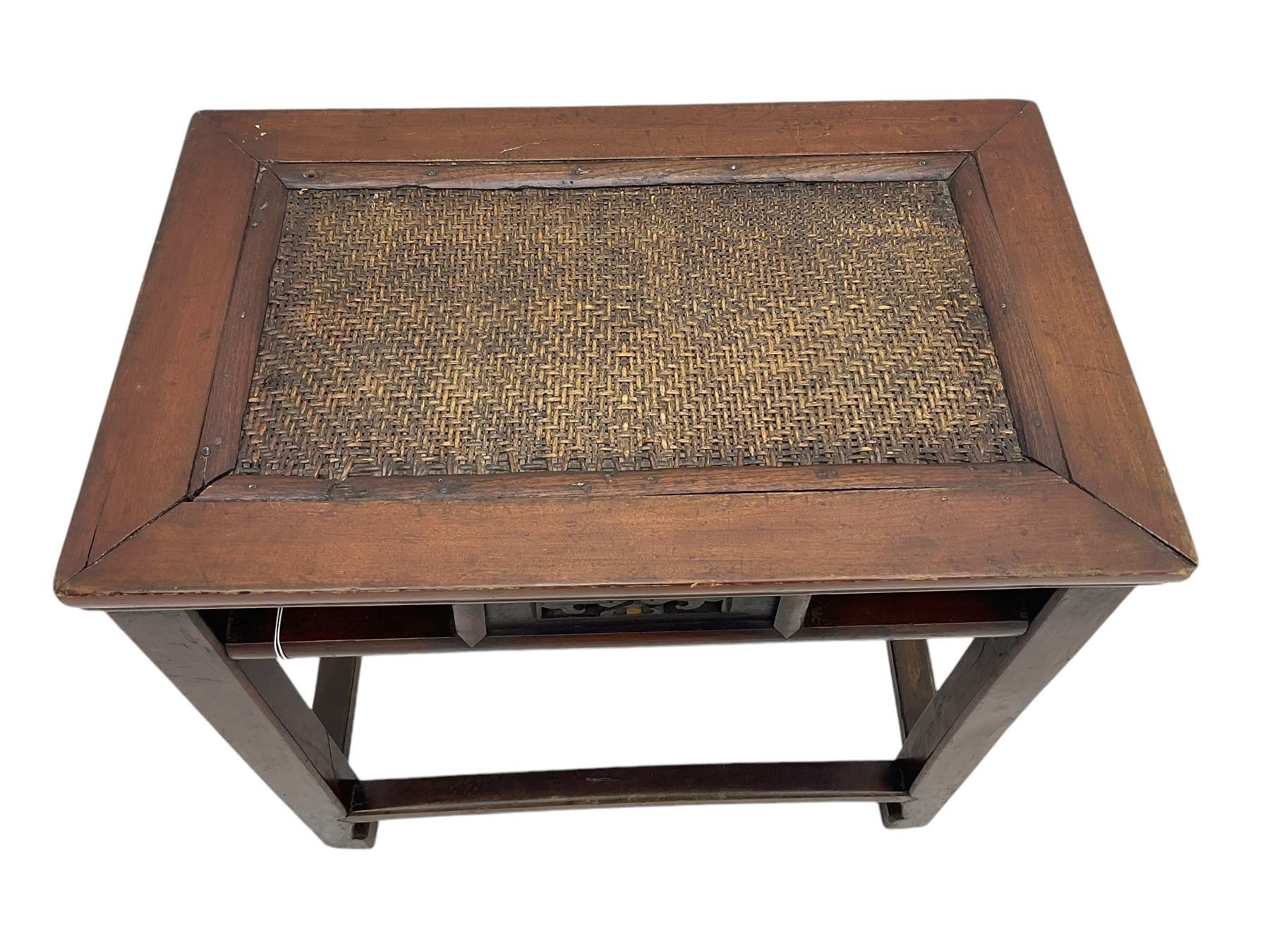 Pair of early 20th century Chinese hardwood side tables, each with rectangular woven cane top, pierced frieze with foliate motif, square supports joined by cross-stretchers