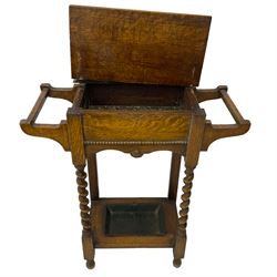 Early 20th century oak work table or hall stand, rectangular top with hinged lid enclosing interior storage, side hanging handles, barley twist supports united by square stretchers, on turned feet