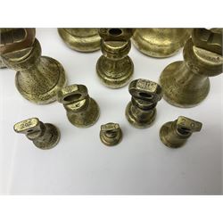 Set of seventeen Victorian brass bell weights