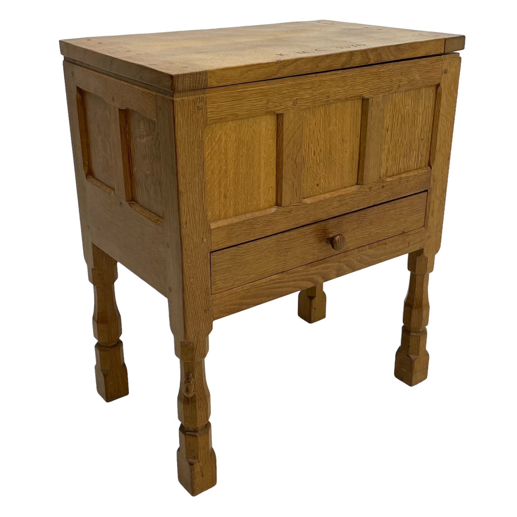 Mouseman - oak work or sewing box, rectangular adzed top inscribed 'L. M. C. 1976' enclosing vacant interior, triple panelled front and double panelled sides, fitted with single drawer, on octagonal supports, carved with mouse signature, by the workshop of Robert Thompson, Kilburn 