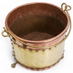 19th/ early 20th century copper and brass coal bucket, with loop handle, cylindrical riveted body and raised on three short claw and ball feet, H30cm x W35cm 