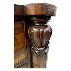 Early Victorian mahogany bow front chest, two short over three long graduating cockbeaded drawers, flanked by faceted columns with carved acanthus leaf capitals, standing on turned bun supports with fluted detailing