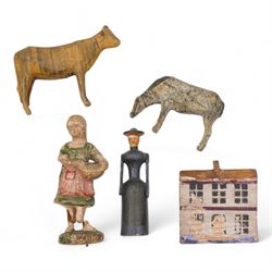 19th century German carved and painted figures including a female figure and two cows, probably from Erzgebirge Noah's Ark, a similar period carved and painted wooden house and an Elastolin figure (5)