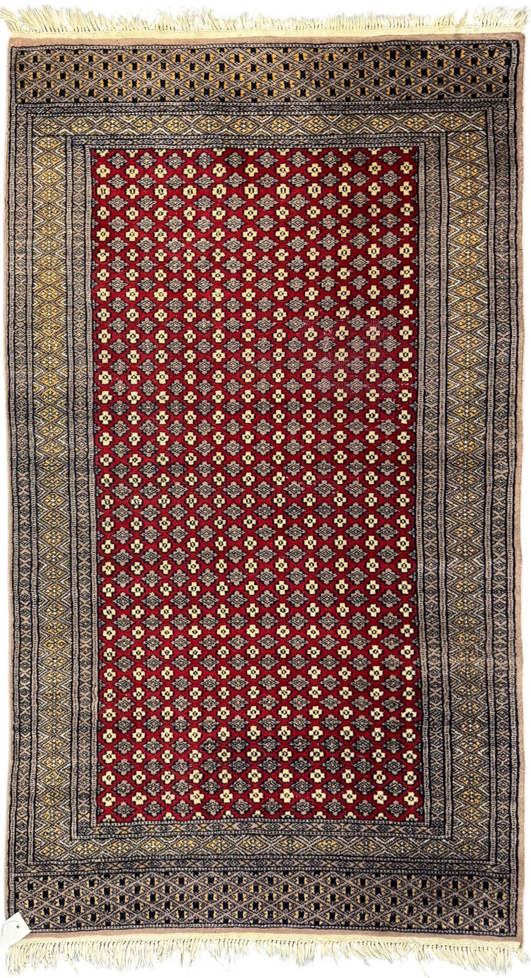 Pakistani Kashan hand-knotted rug with a central medallion and intricate geometric floral patterns, set against a red field and framed by a multi-band border; Pakistani Kashan rug with a repeating floral motif across the red field, enclosed by a detailed geometric border in complementary tones (2)