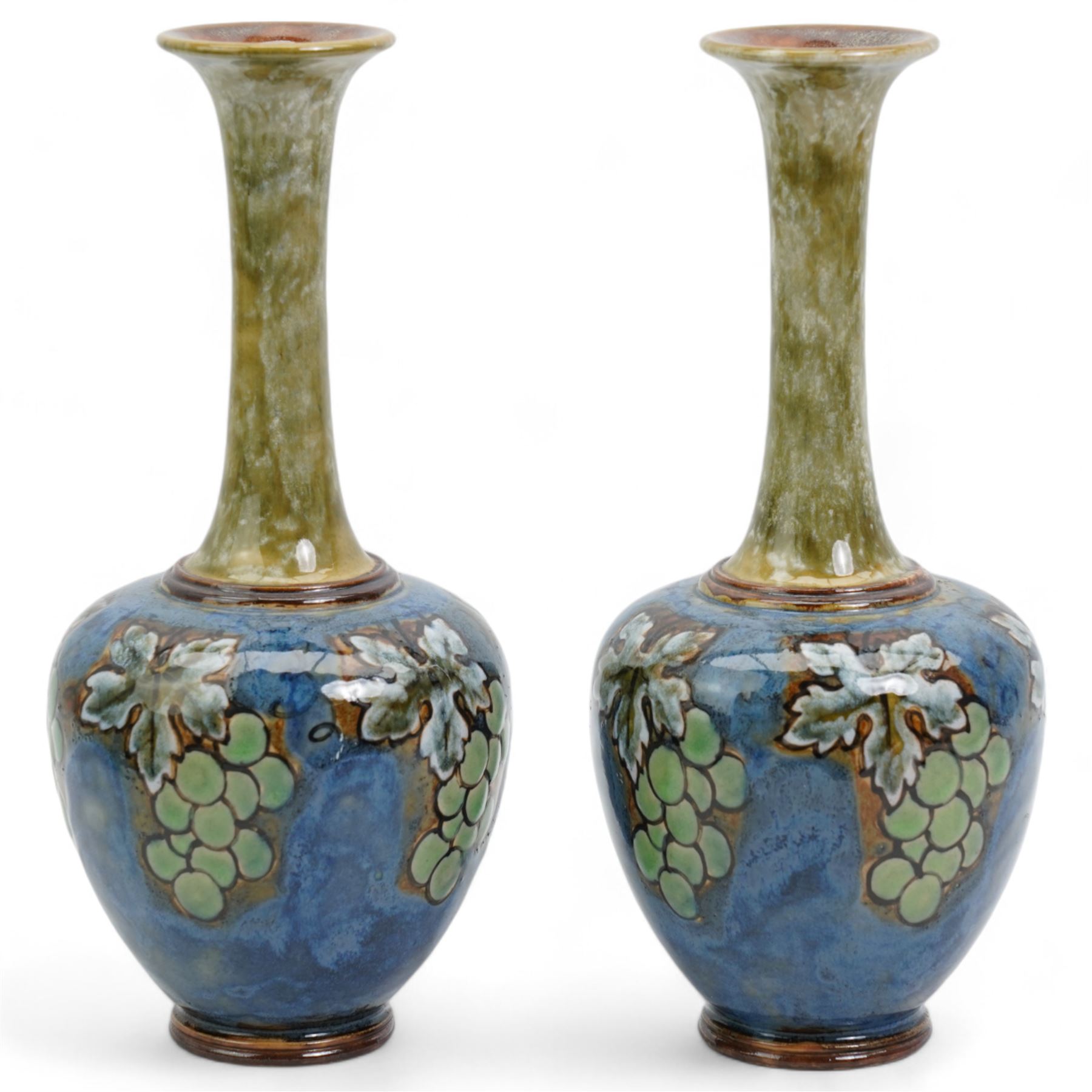 Pair of Royal Doulton stoneware bottle vases, decorated with bunches of grapes, inscribed E.B, impressed 8460, H26cm 