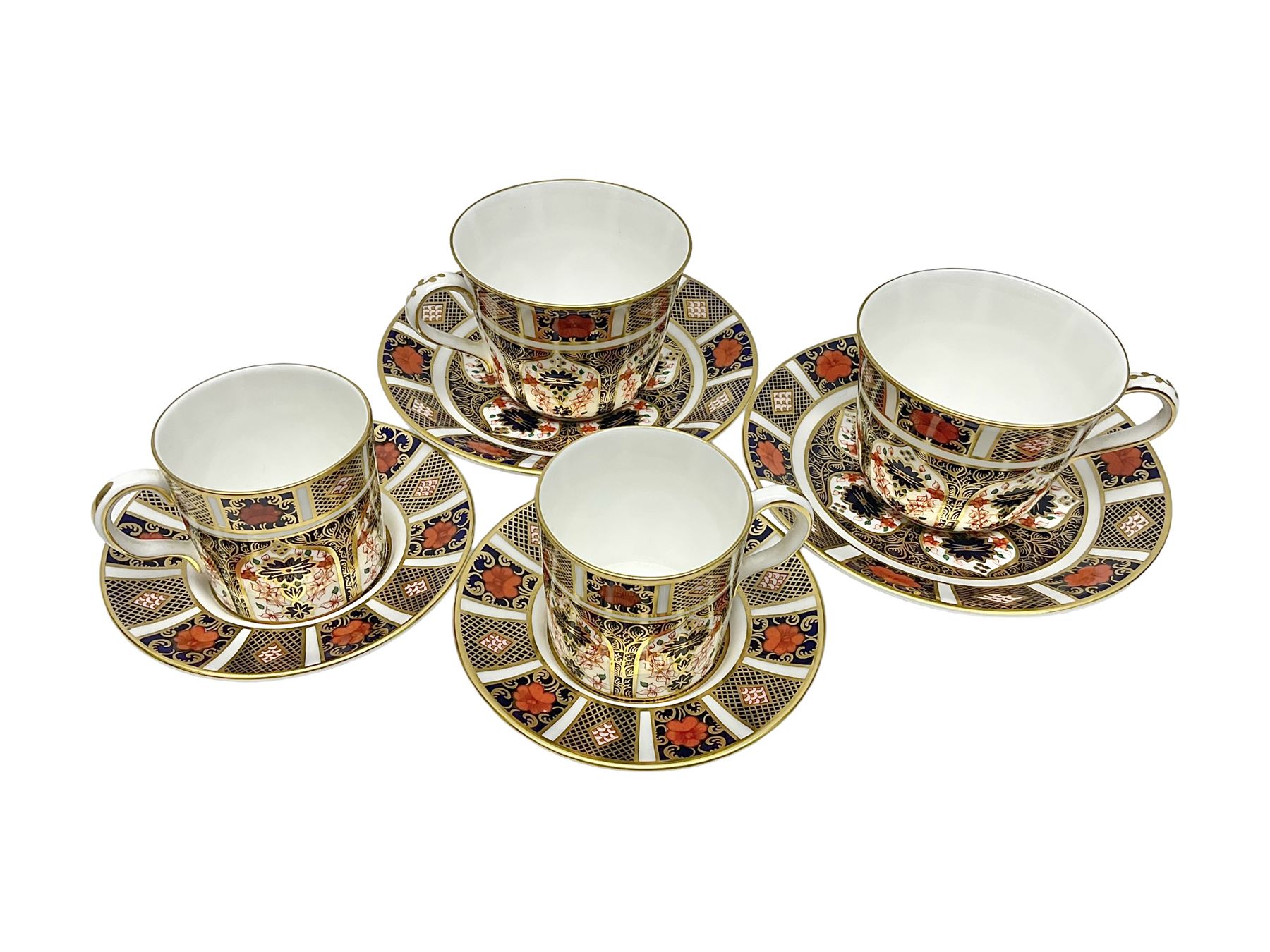 Royal Crown Derby 1128 Imari pattern two coffee cans and saucers, two teacups and saucers, all with printed mark beneath 