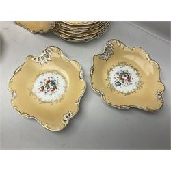 Victorian part dessert service, including eighteen plates, four small serving dishes, shallow dish, etc hand painted with floral sprigs within a cream border with floral panels, and heightened in gilt (26cm)