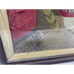 19th century woolwork, depicting a clipper ship, fully rigged over black hull with white ports, within a border of ensigns and flags and beaded crown above, in glazed wooden frame, H57cm