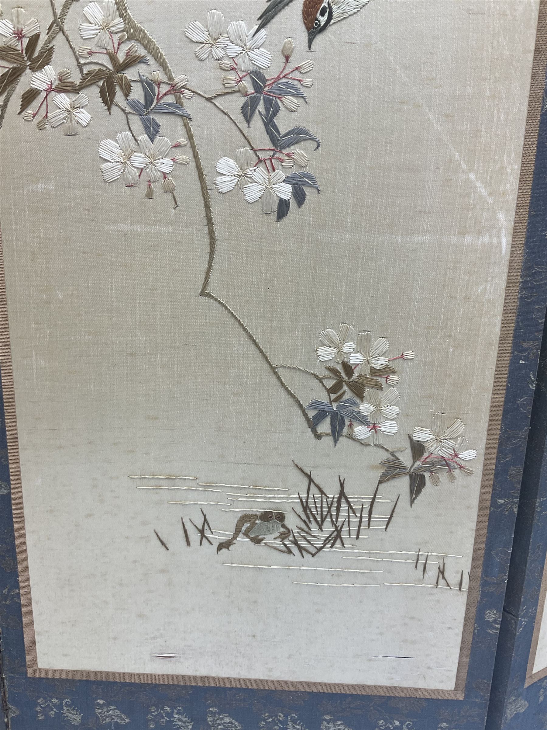 Two Oriental silk and wooden screens embroidered with birds and blossoming branches, largest H88cm 