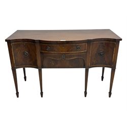 Early 19th century serpentine sideboard, fitted with two cupboards and two drawers, on square tapering supports with spade feet