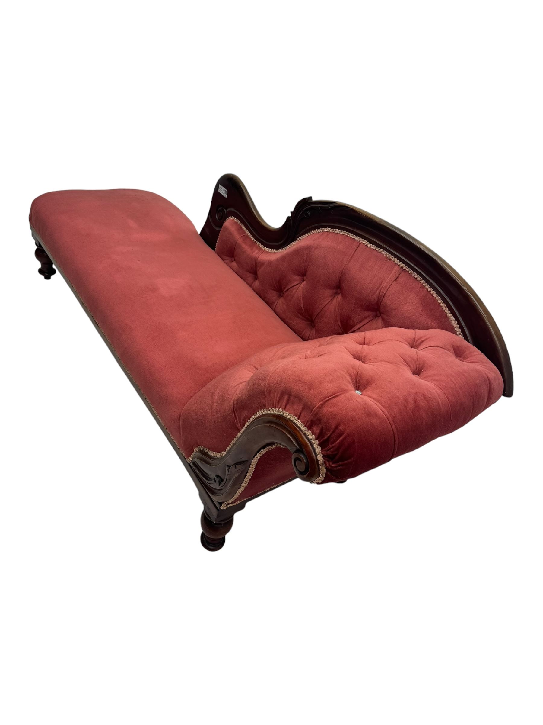 Victorian mahogany framed chaise longue, upholstered in pink velvet, the scrolled back with button-tufting, on turned feet