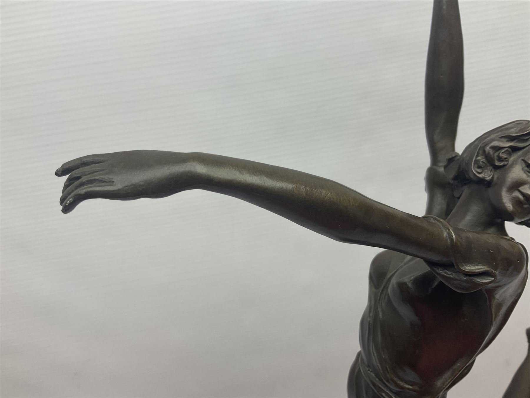 Art Deco style bronze, after Bruno Zach, modelled as a dancer with her arms raised, on a veined marble tapering base signed B. Zach and with foundry seal, H65cm