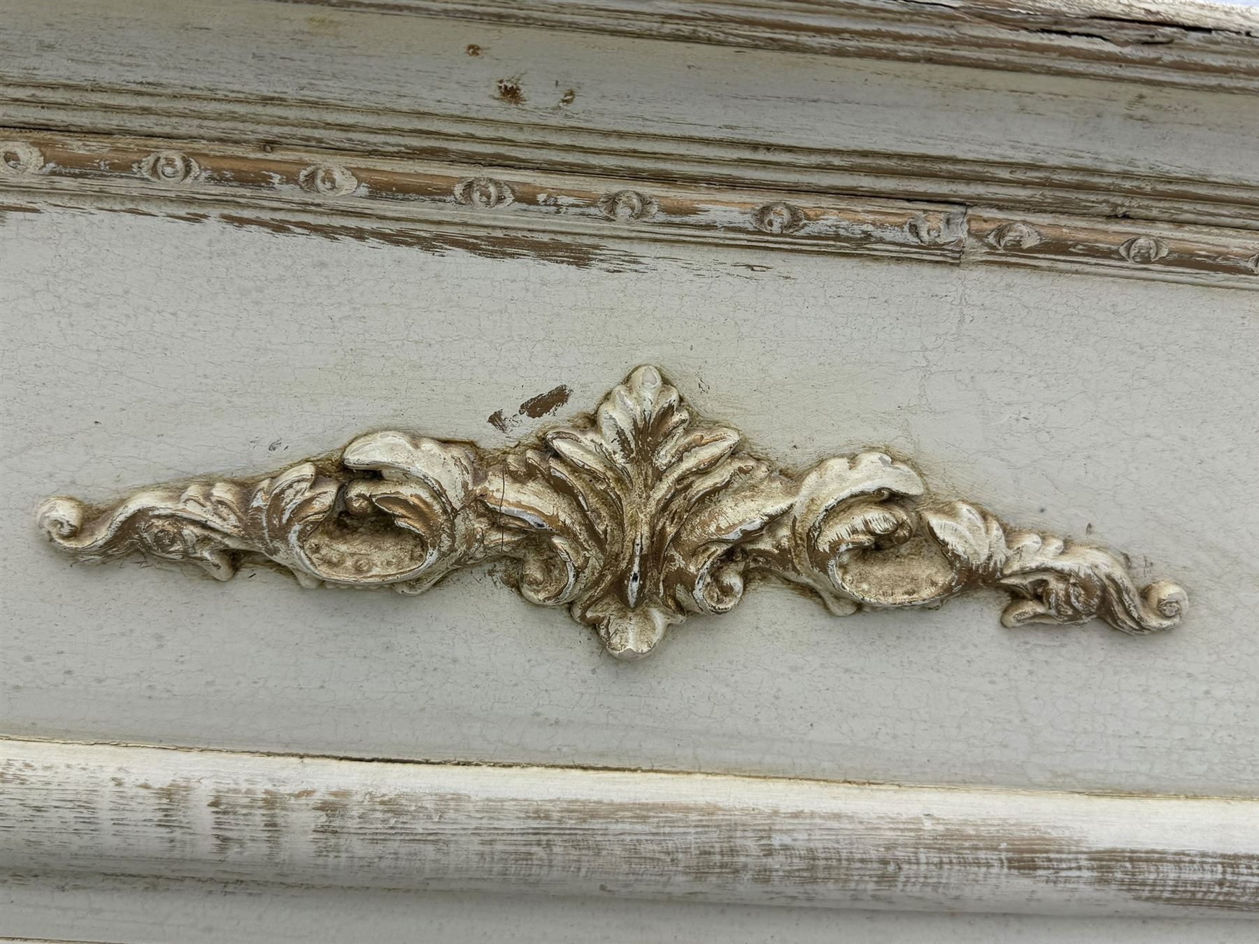 French style white painted pier glass mirror, decorated with scrolled acanthus leaf and anthemion mounts, bevelled mirror plate 