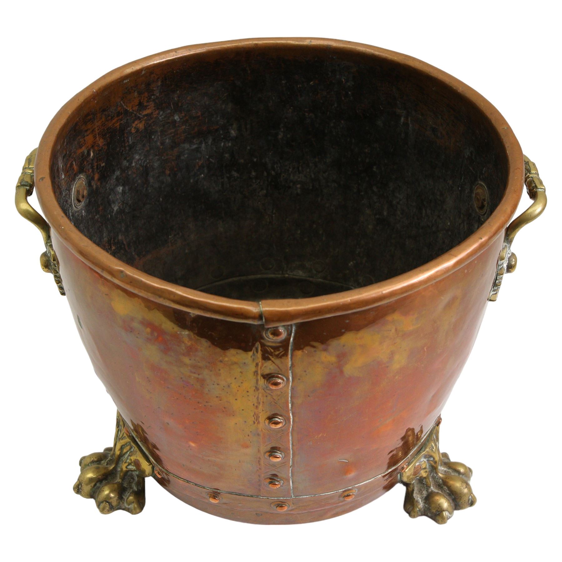 19th/ early 20th century copper coal bin, having twin cast brass handles, riveted base and three brass lion paw supports, H30cm, W42cm 