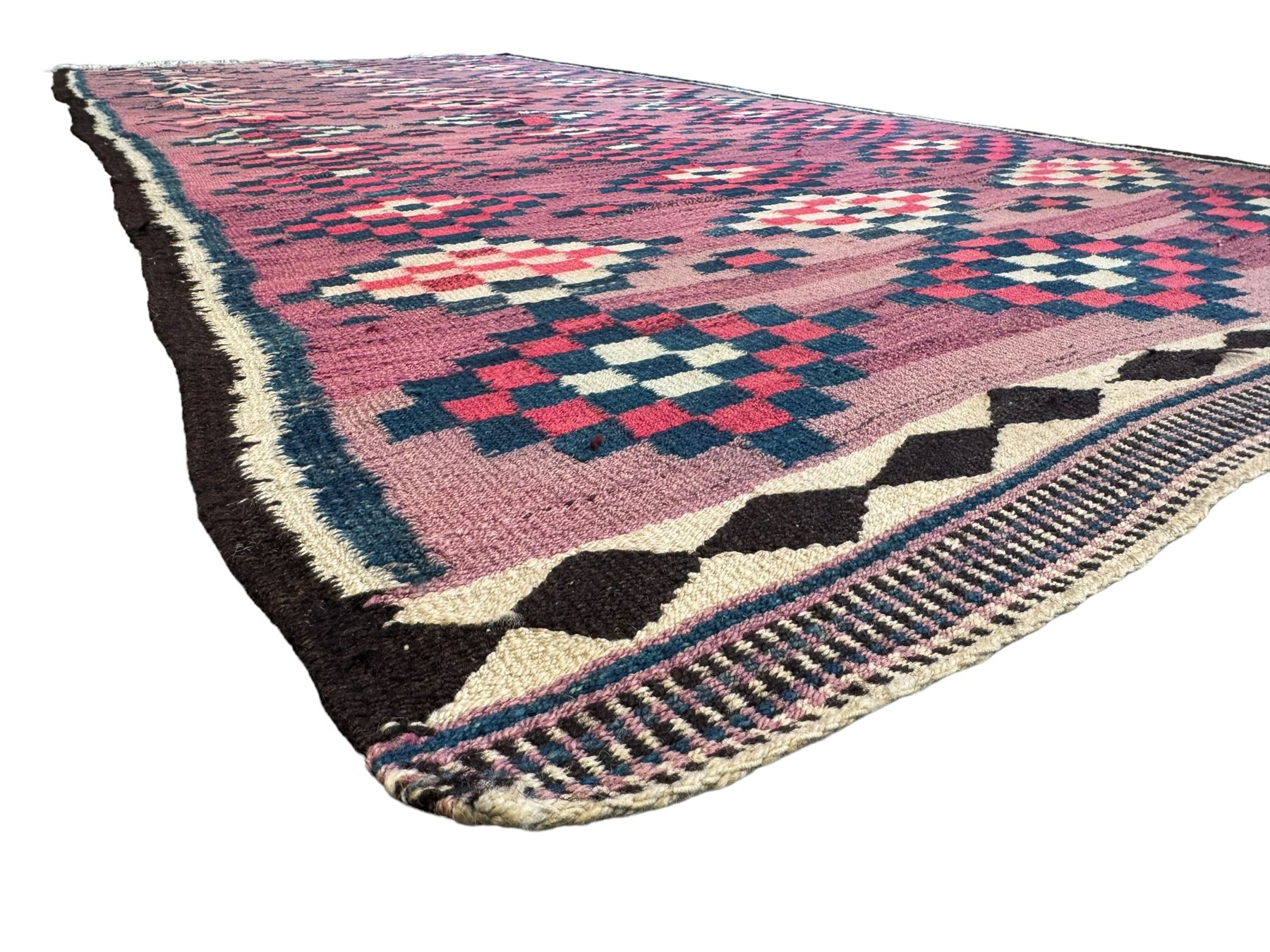 Turkish Anatolian lilac ground kilim rug, the field decorated with three columns of geometric lozenges, enclosed by plain guard stripes 