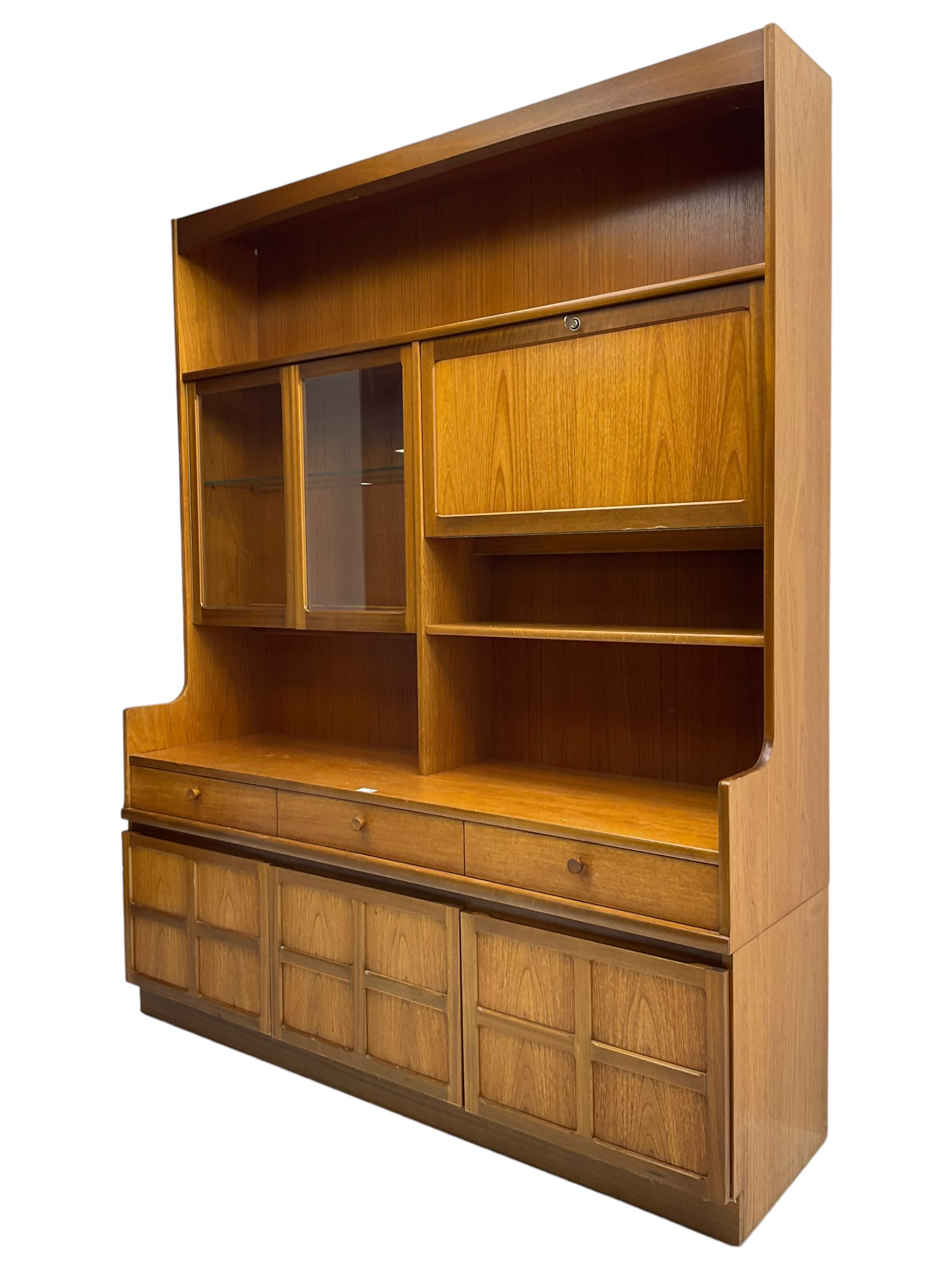 Nathan - teak wall unit, fitted with raised display cabinet and fall front compartment, three drawers and three cupboards below