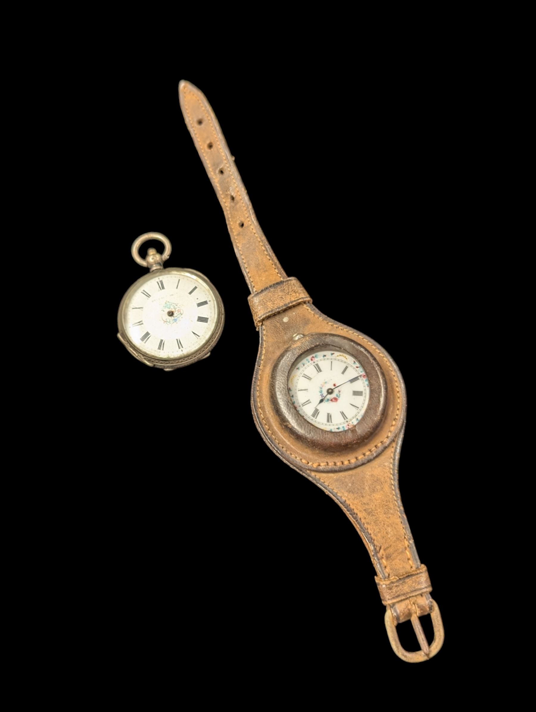 Two continental silver fob watches with enamel dials, one stamped 800, one stamped 935 and in leather wriststrap