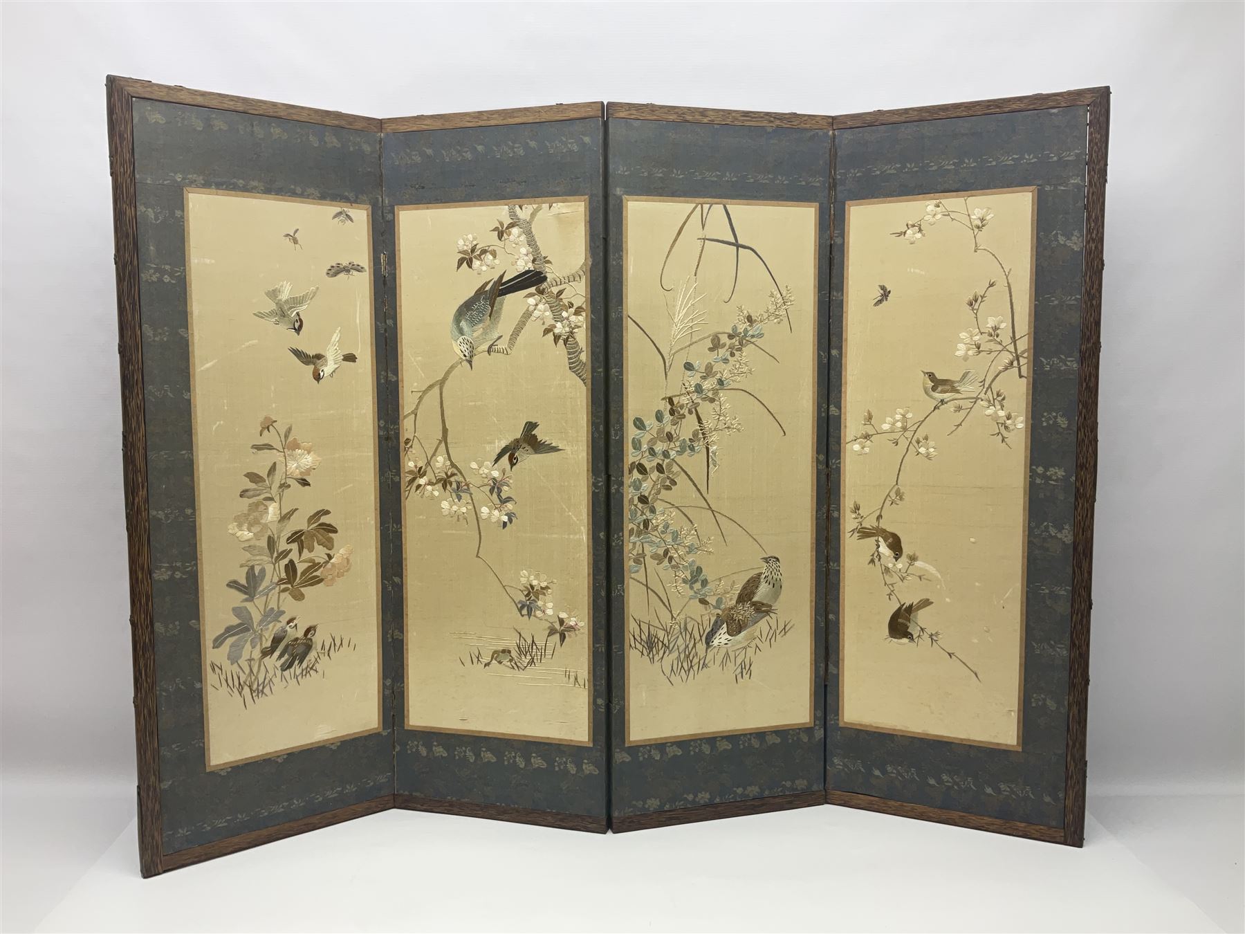 Two Oriental silk and wooden screens embroidered with birds and blossoming branches, largest H88cm 