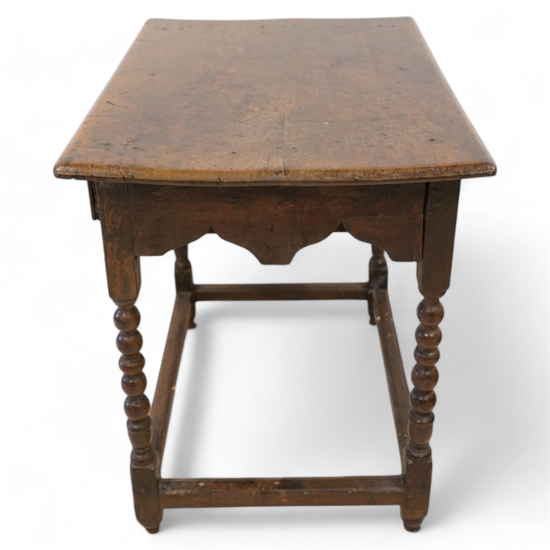 17th century oak side table, two plank rectangular top over single drawer, on bobbin-turned supports united by stretchers 