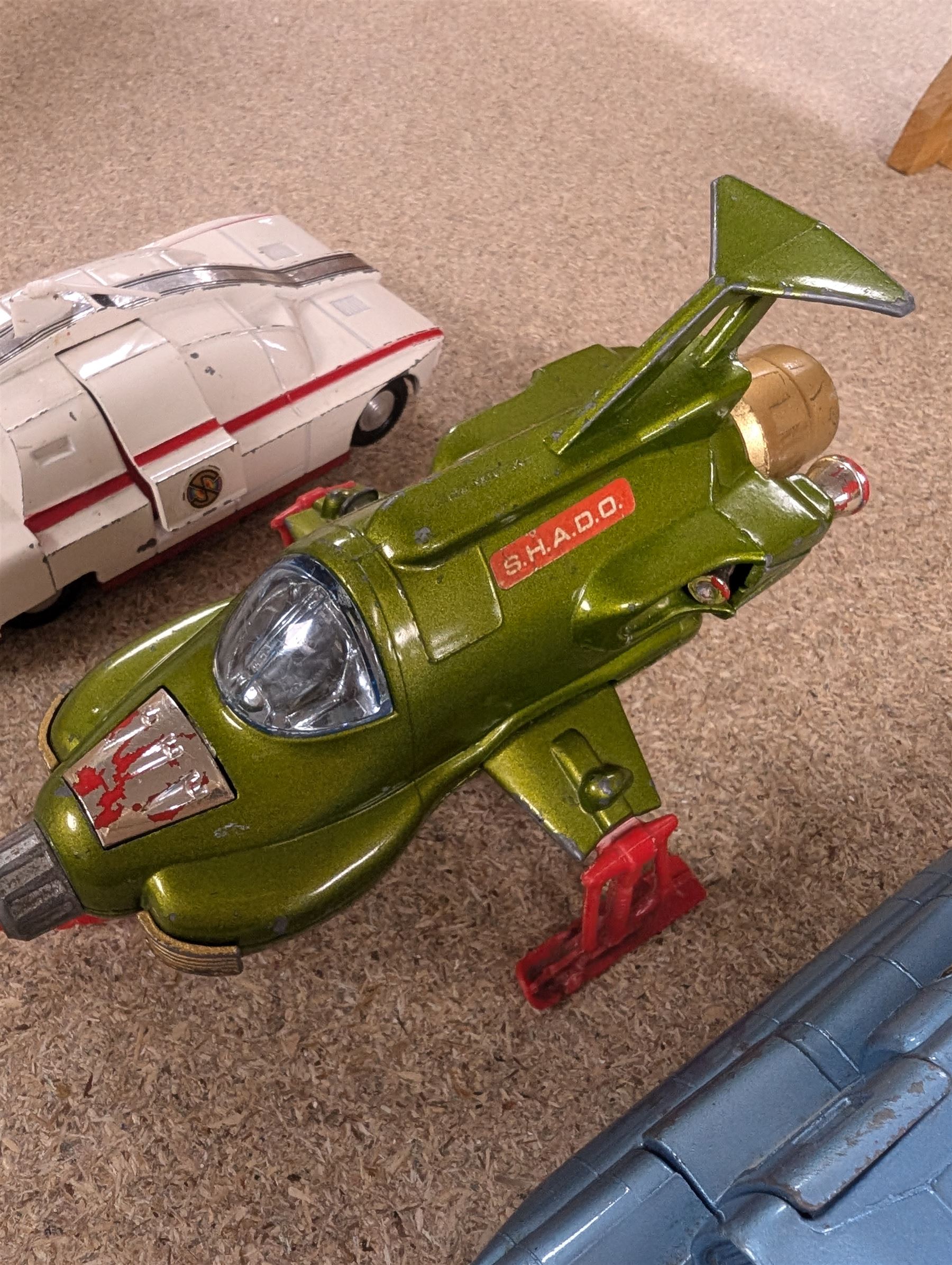 Three Dinky toys, comprising Spectrum Pursuit Vehicle, Maximum Security Vehicle, and UFO Interceptor, unboxed and playworn 