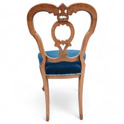 Set of six Victorian carved walnut dining chairs, shaped cresting rail over C-scroll splat back, upholstered in blue velvet, on cabriole supports 