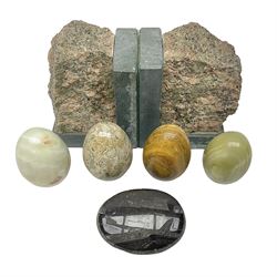 Fossilised coral egg, together with three onyx eggs, mineral bookends and a carved stone