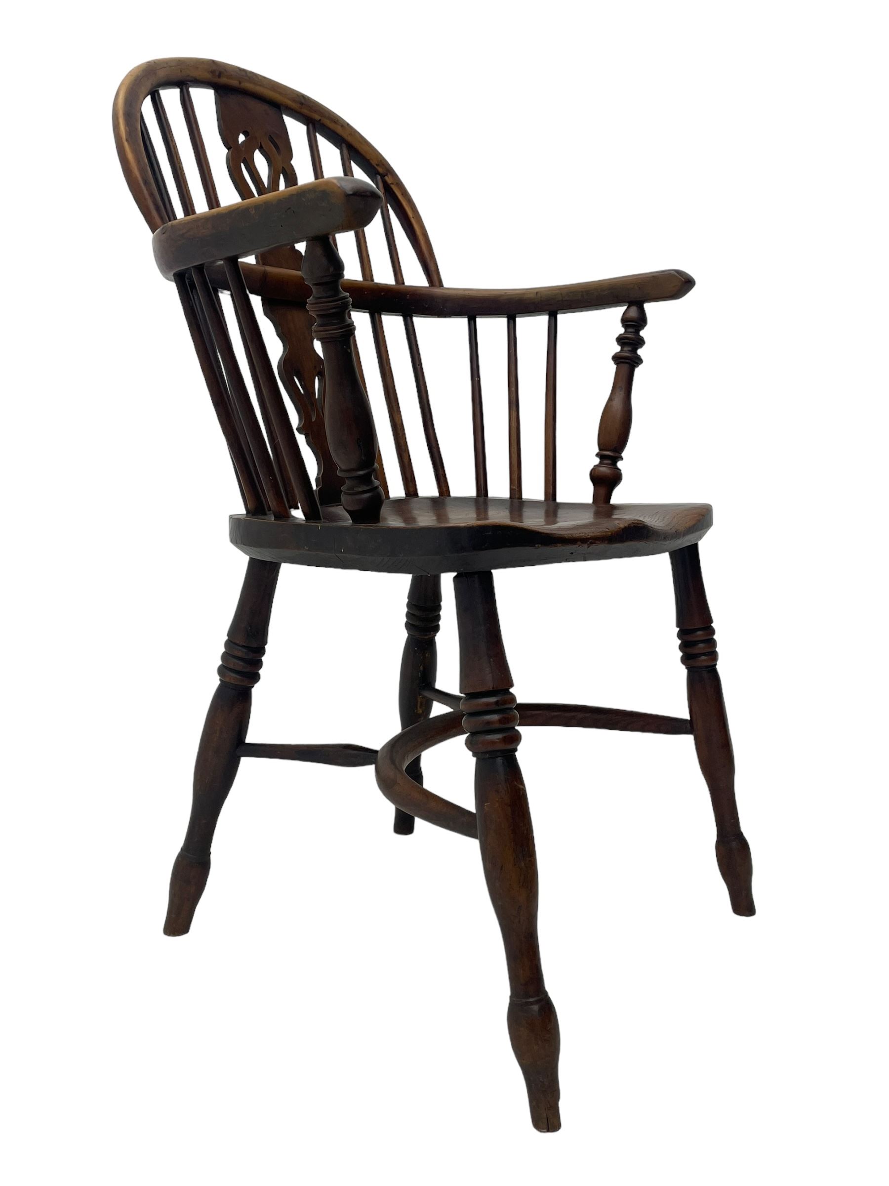 19th century yew wood and elm Windsor armchair, low double hoop stick and pierced splat back, dished seat on turned supports united by crinoline stretchers